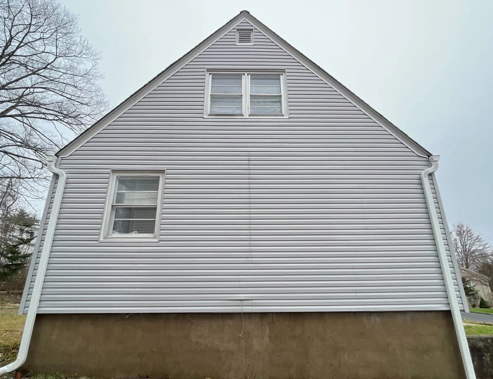 Westlake Power Washing technician performing detailed house washing in Westlake residential area