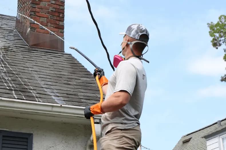 Westlake Power Washing professional performing gentle roof washing service in Westlake